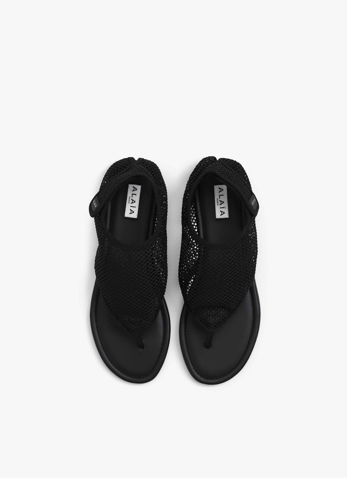 THONG SANDALS IN FISHNET ALAÏA BLACK THONG SANDALS IN FISHNET